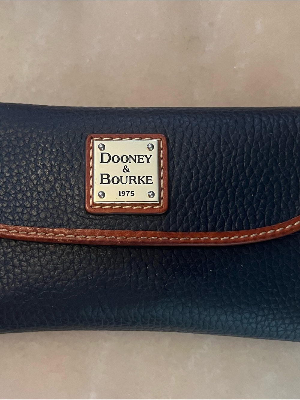 Dooney & Bourke Navy Pebbled Leather Wallet with Brown Trim